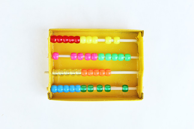 Make a very simple DIY abacus and learn how to use it to add numbers.