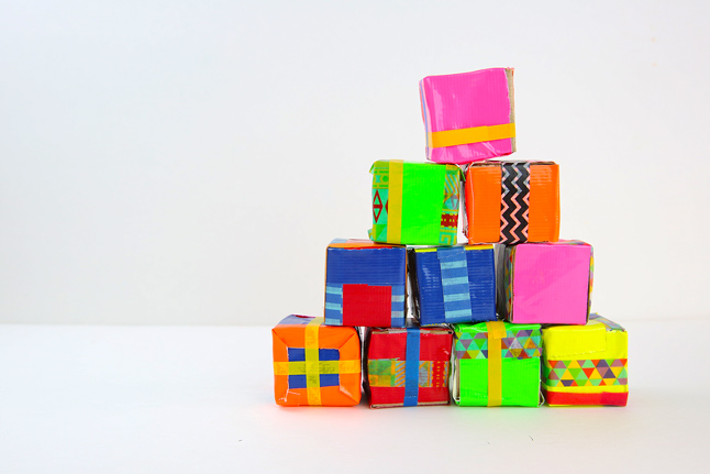 Make this fun recycled craft by turning cardboard tubes into a set of colorful toy blocks!