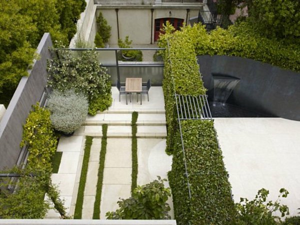 patio design idea tiles flooring grass accents outdoor furniture