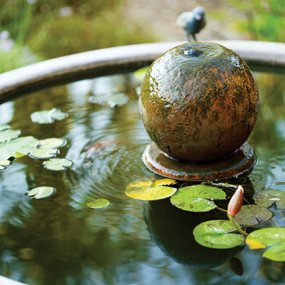 Fountain with stone orb